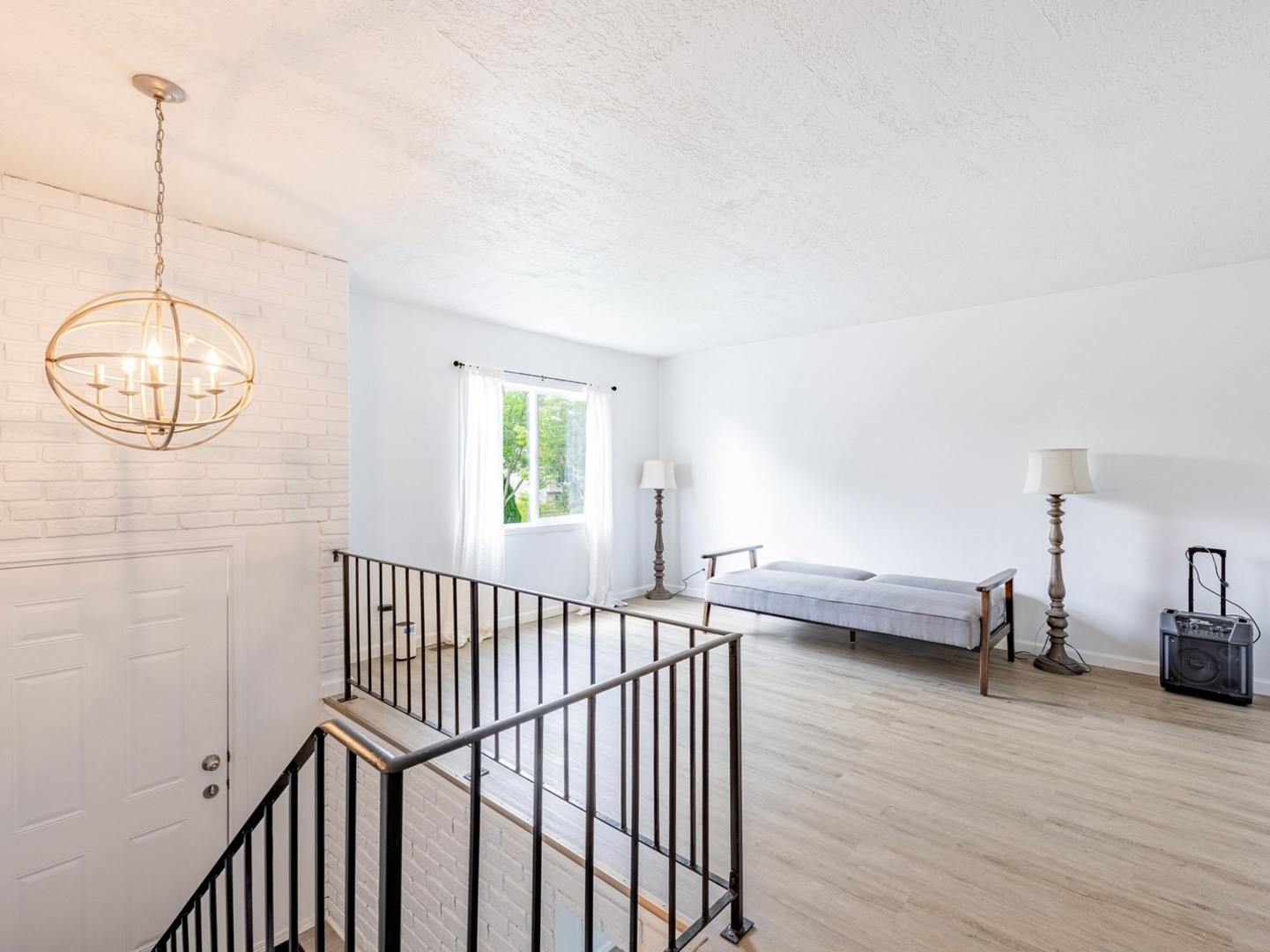 228 Riverside Drive Bolingbrook, IL 60440 - Photo 2 of 22 a view of a room with wooden floor and windows
