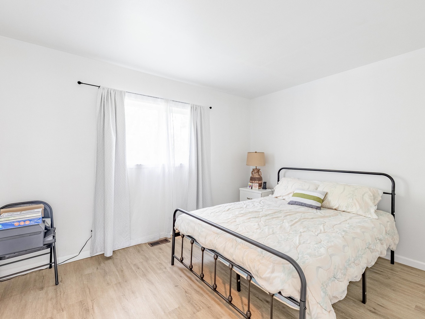 228 Riverside Drive Bolingbrook, IL 60440 - Photo 8 of 22 a bedroom with a bed and wooden floor