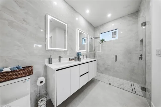 an empty room with closet and windows