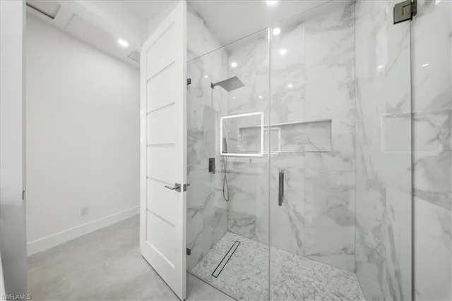 a view of a room with furniture and natural light