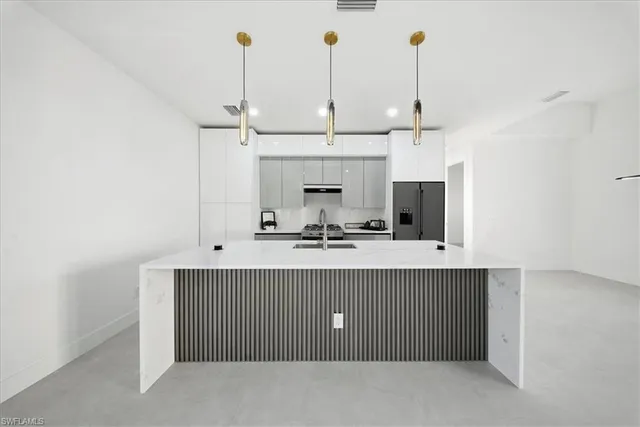 a view of a kitchen with a sink