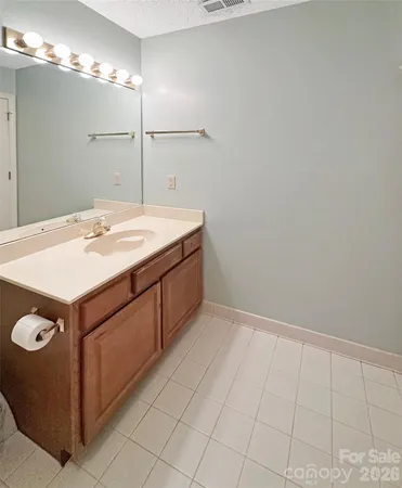 a bedroom with a bed chair and window