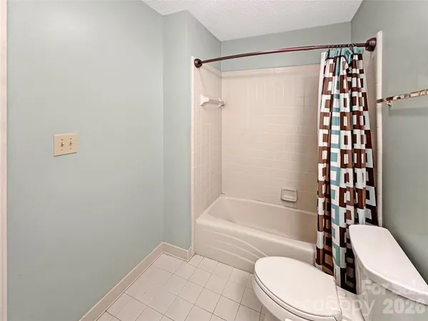 a view of storage and utility room with wooden floor