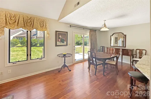 a kitchen with a refrigerator a stove a sink and a counter space