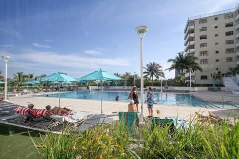 100 Lincoln Road, Unit 739 Miami Beach, FL 33139 - Photo 24 of 33 a view of a swimming pool and a chairs
