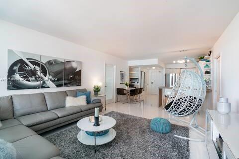 100 Lincoln Road, Unit 739 Miami Beach, FL 33139 - Photo 3 of 33 a living room with furniture and a wooden floor