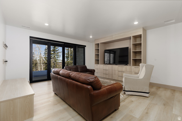 160 Ridgeview Street, Unit 7B Brian Head, UT 84719 - Photo 34 of 40 Family room featuring light wood-type flooring, built in features, and recessed lighting