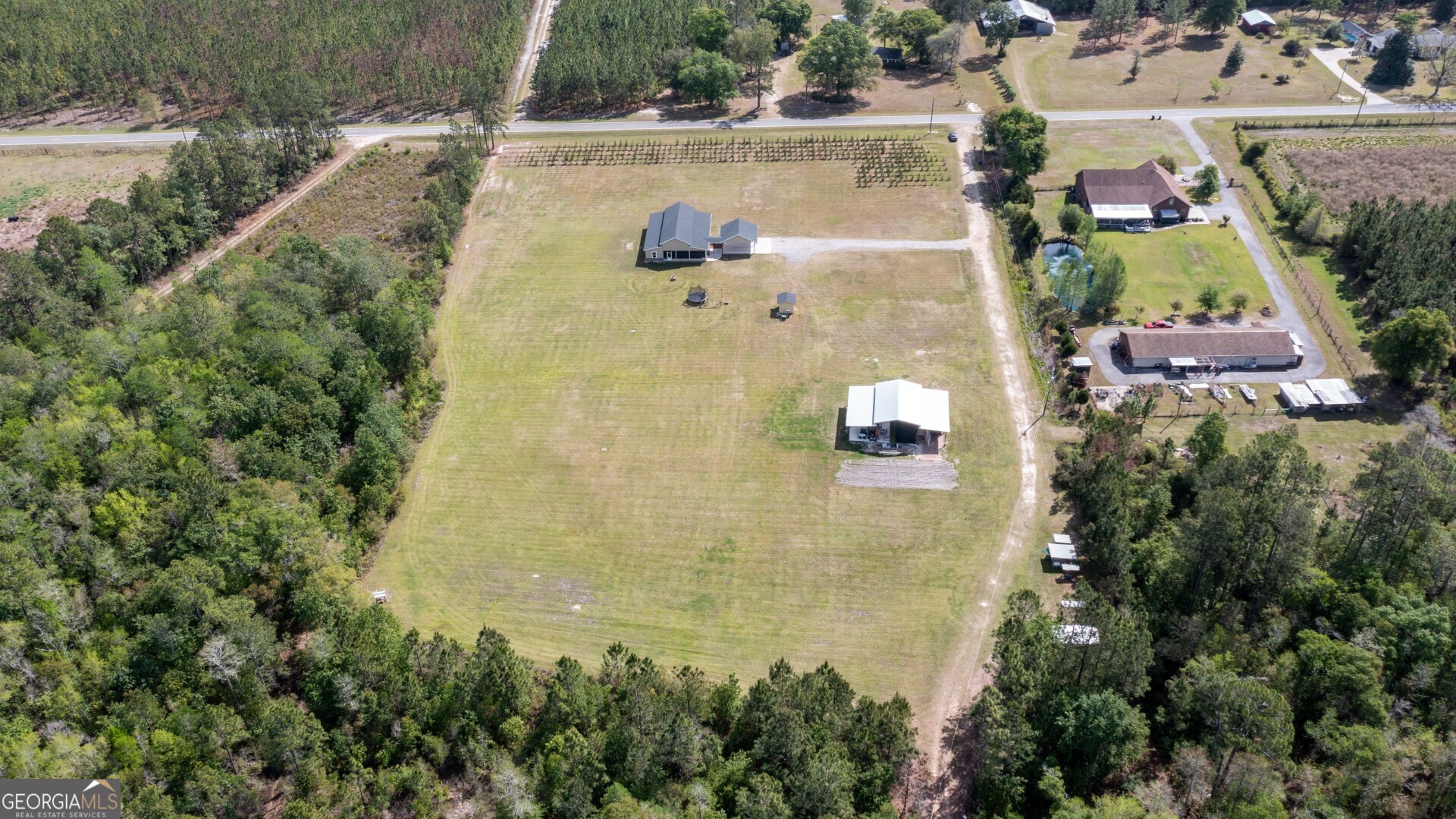6213 Spanish Creek Road Folkston, GA 31537 - Photo 11 of 38 an aerial view of residential house with outdoor space and swimming pool