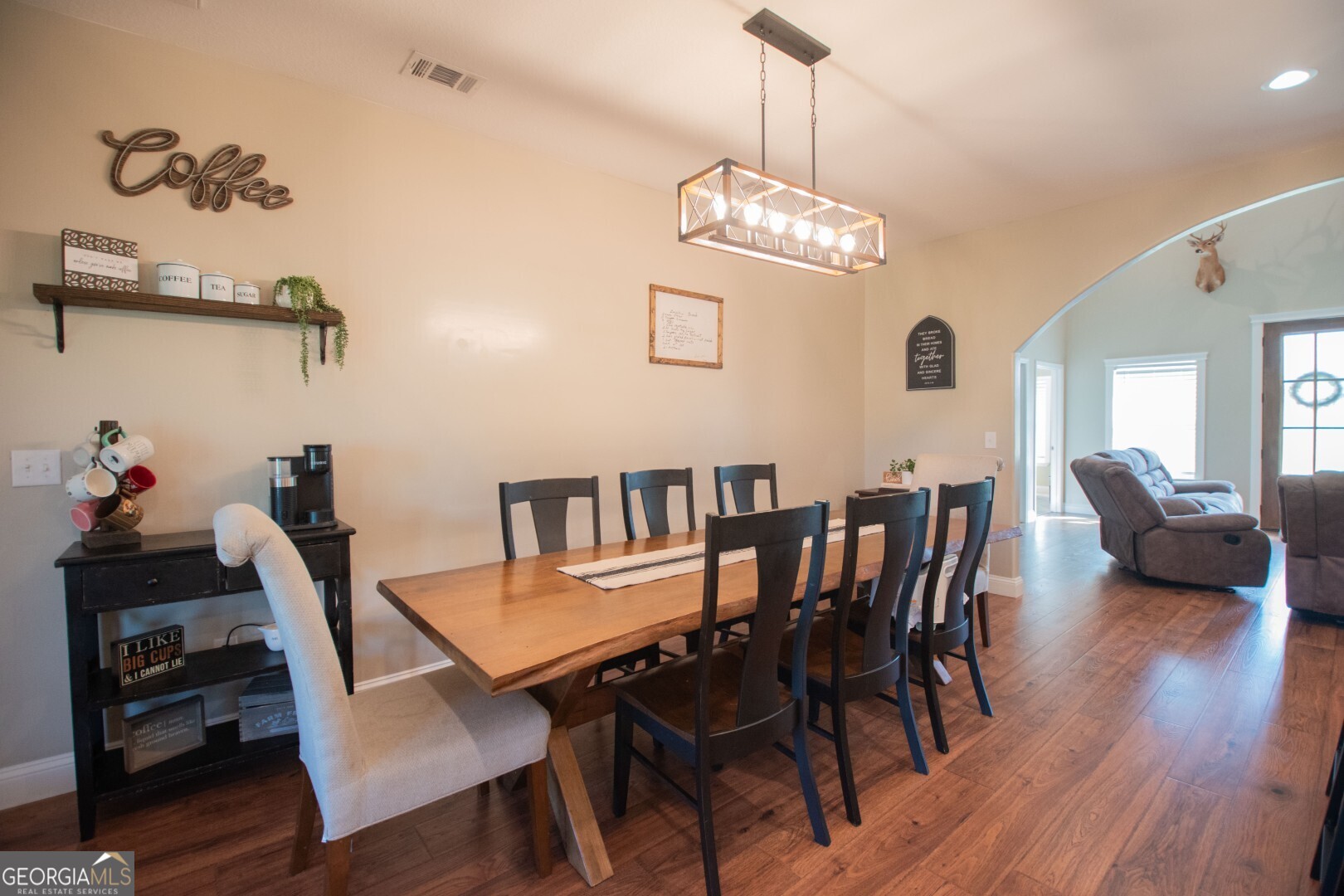 6213 Spanish Creek Road Folkston, GA 31537 - Photo 23 of 38 a view of a dining room with furniture and wooden floor