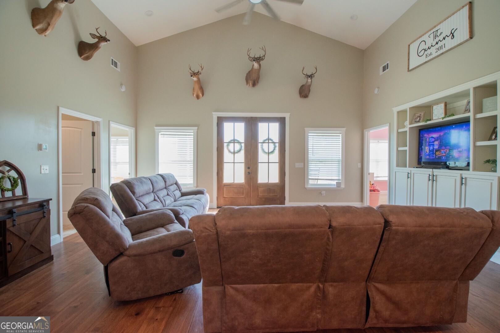 6213 Spanish Creek Road Folkston, GA 31537 - Photo 24 of 38 a living room with furniture a flat screen tv and a window