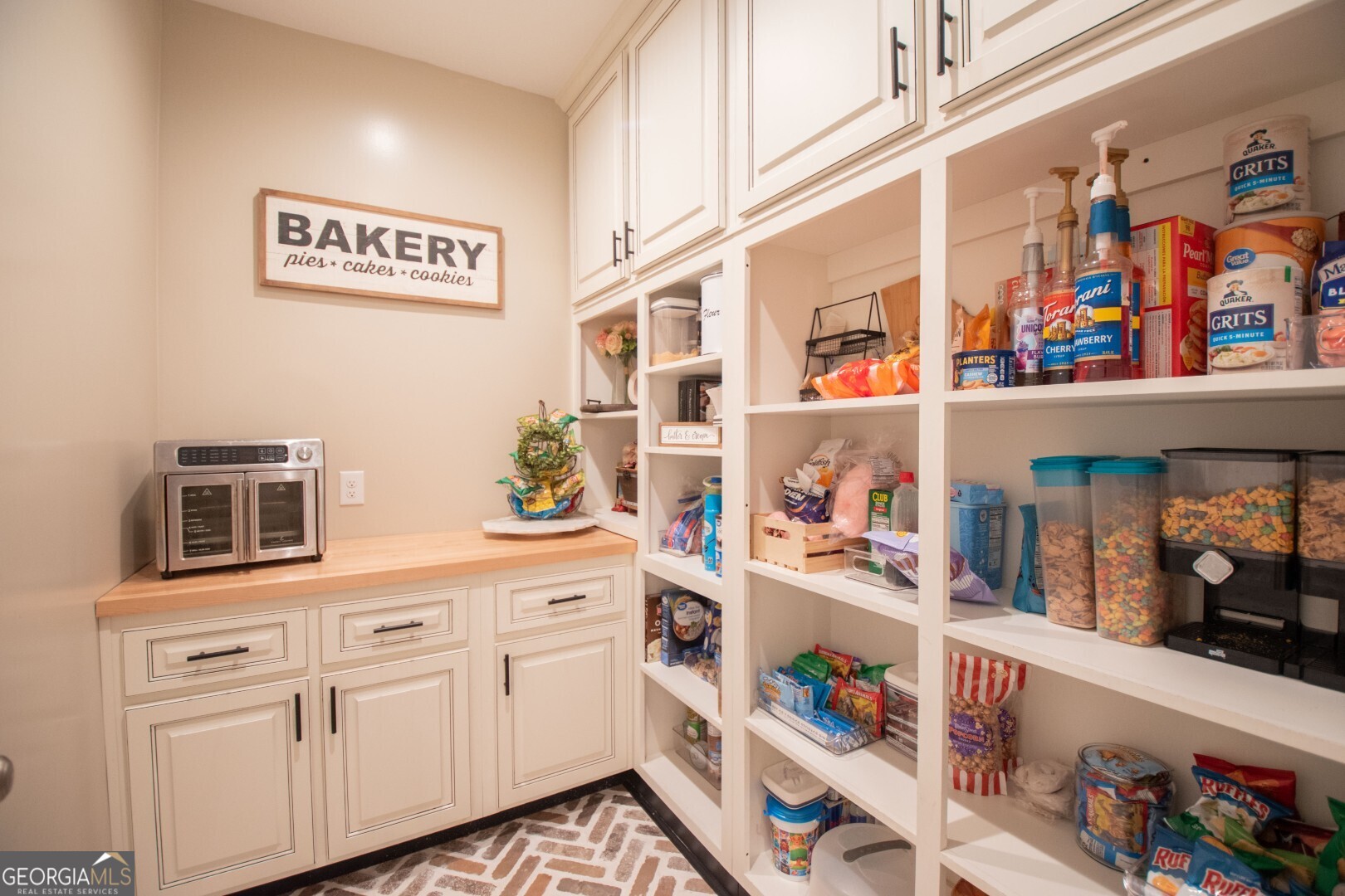 6213 Spanish Creek Road Folkston, GA 31537 - Photo 25 of 38 a kitchen with stainless steel appliances granite countertop a lot of counter space and cabinets