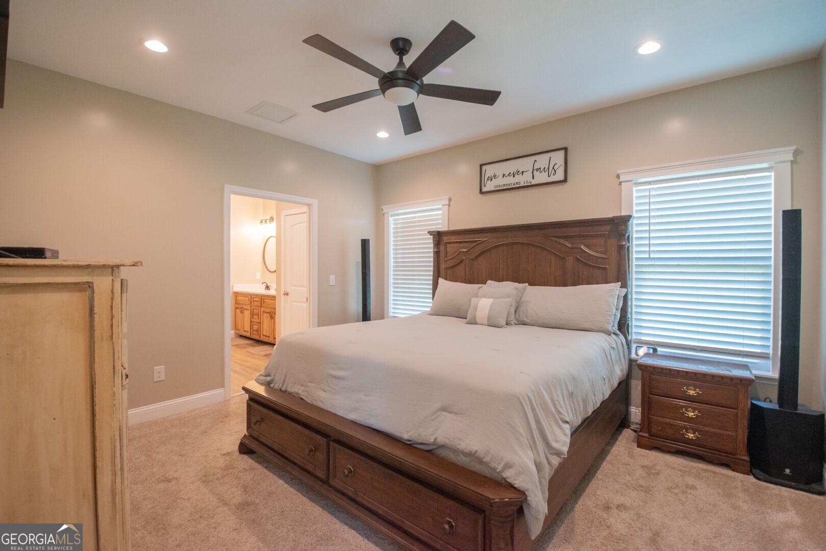 6213 Spanish Creek Road Folkston, GA 31537 - Photo 27 of 38 a spacious bedroom with a bed and a ceiling fan