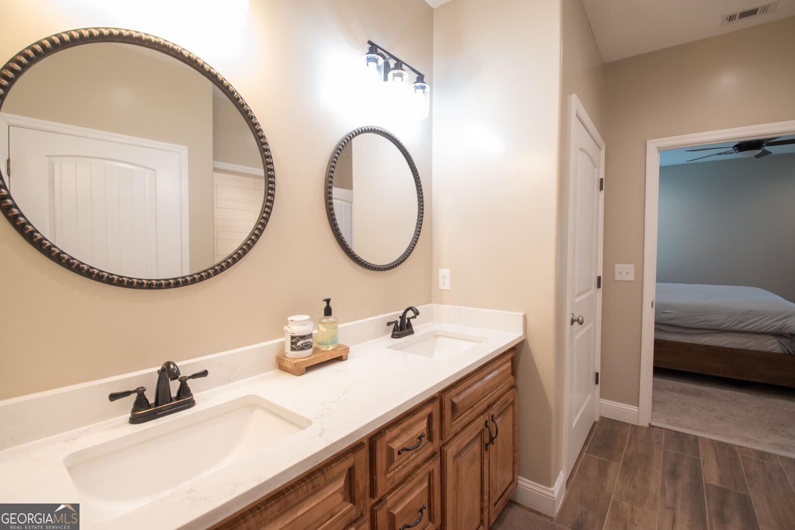 6213 Spanish Creek Road Folkston, GA 31537 - Photo 29 of 38 a en suite bathroom with a double vanity sink and a mirror