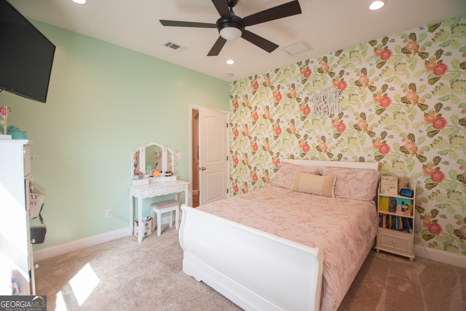 6213 Spanish Creek Road Folkston, GA 31537 - Photo 33 of 38 a bedroom with a bed window and a flat screen tv