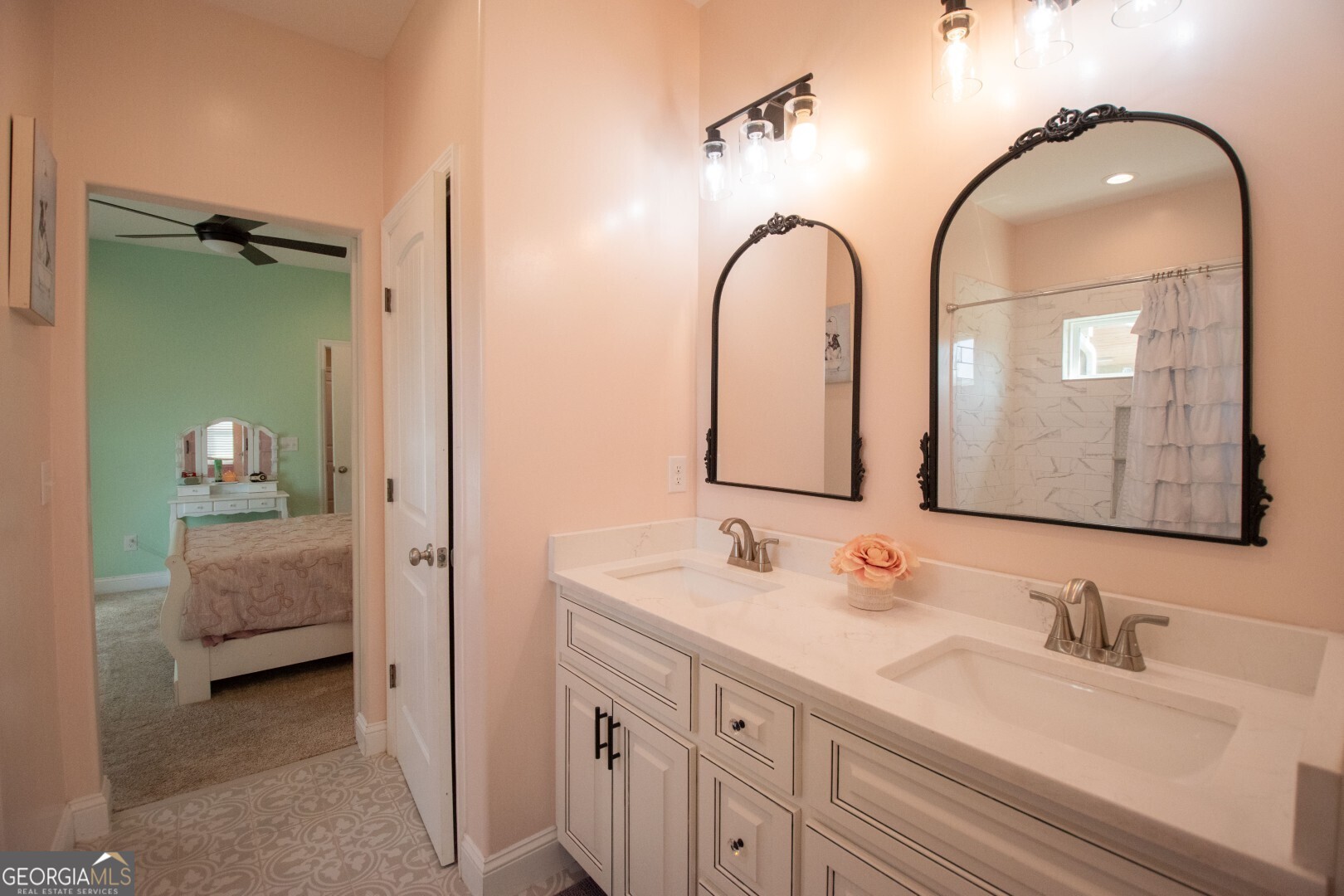 6213 Spanish Creek Road Folkston, GA 31537 - Photo 34 of 38 a en suite bathroom with a double vanity sink and a mirror