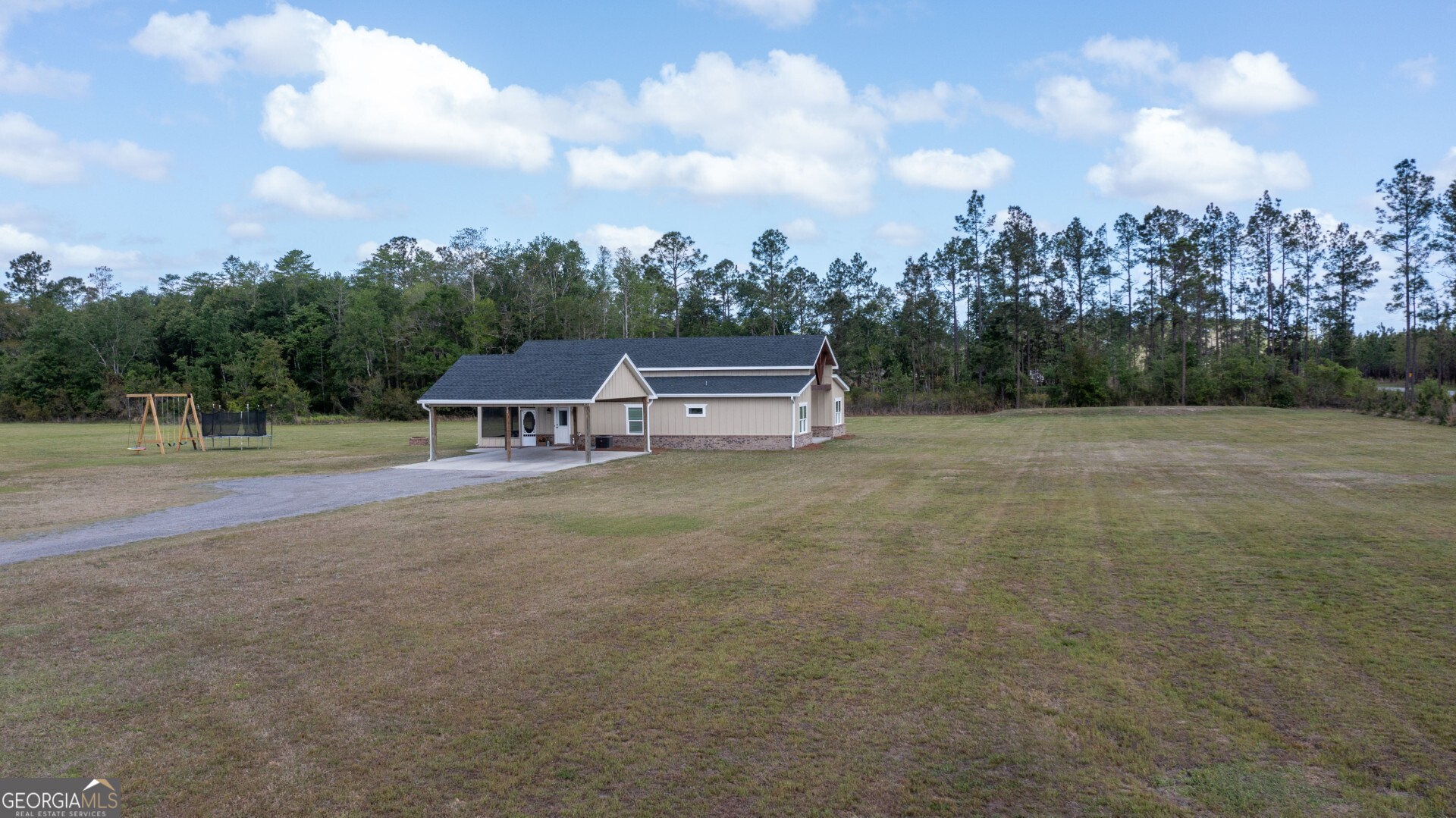 6213 Spanish Creek Road Folkston, GA 31537 - Photo 4 of 38 a view of a field with trees in the background