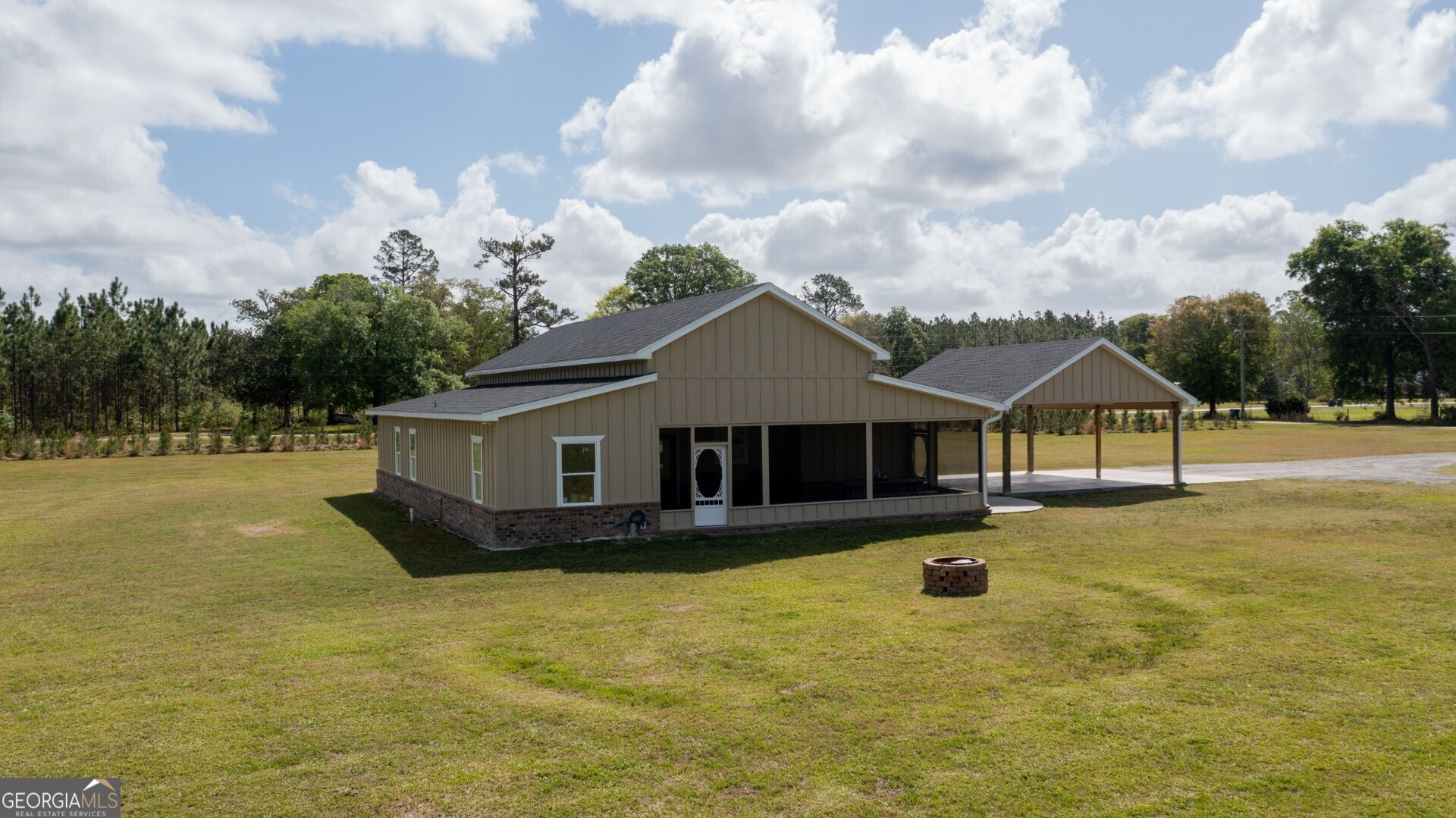 6213 Spanish Creek Road Folkston, GA 31537 - Photo 7 of 38 a front view of house with yard and swimming pool