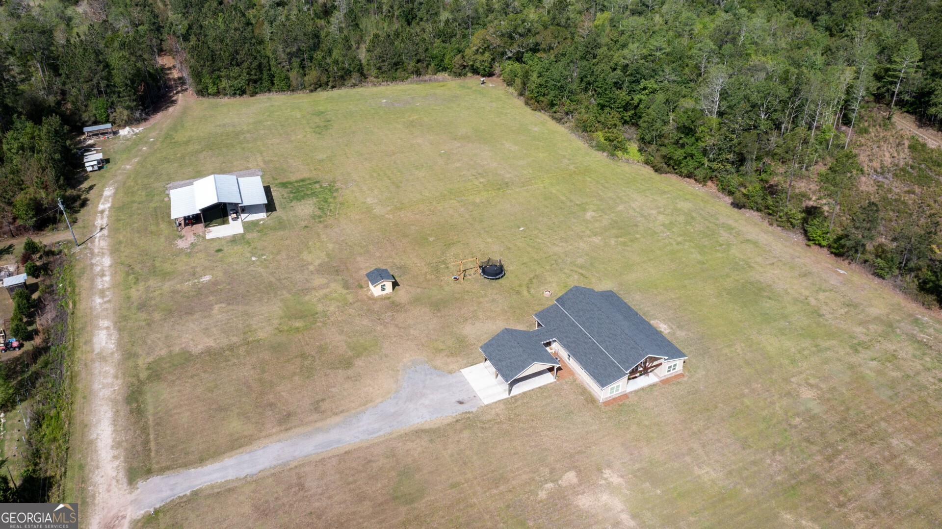 6213 Spanish Creek Road Folkston, GA 31537 - Photo 8 of 38 an aerial view of a house with a yard