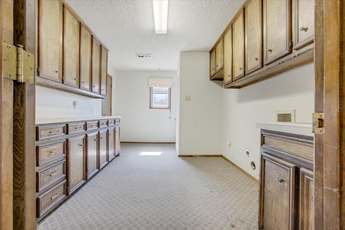 1106 15th Street Shallowater, TX 79363 - Photo 16 of 24 Large Utility Room with lots of storage
