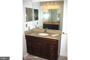 2837 Cox Neck Road Chester, MD 21619 - Photo 20 of 29 a bathroom with a sink and a mirror