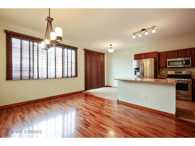 15646 Scotsglen Road Orland Park, IL 60462 - Photo 5 of 14 a view of kitchen with window and wooden floor