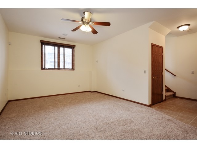 15646 Scotsglen Road Orland Park, IL 60462 - Photo 6 of 14 a view of an empty room with a window