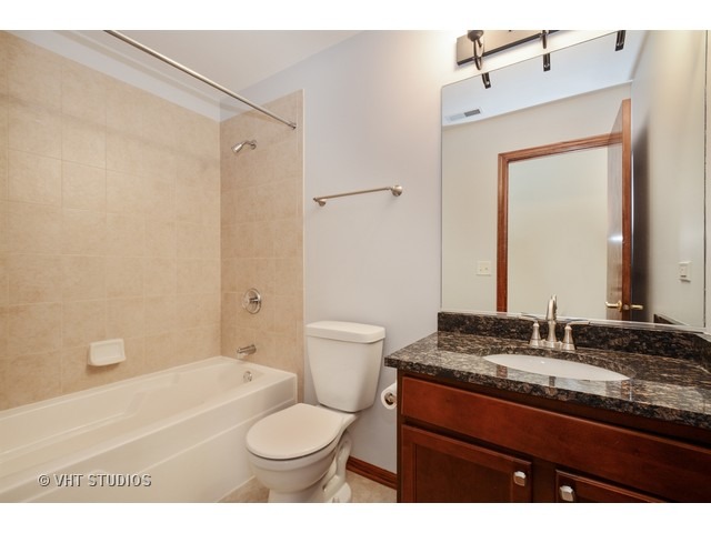 15646 Scotsglen Road Orland Park, IL 60462 - Photo 10 of 14 a bathroom with a granite countertop sink toilet and shower