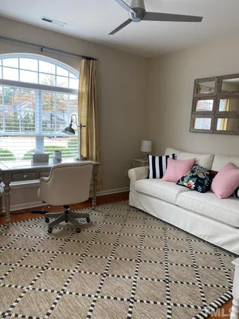 a living room with a couch and a window