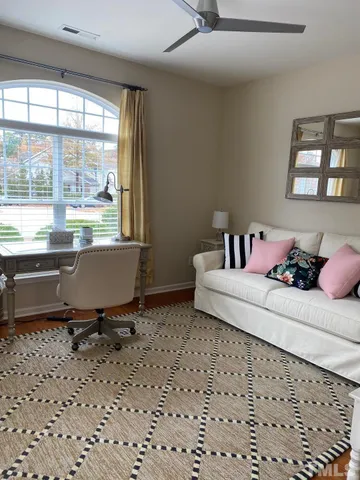 a living room with a couch and a window