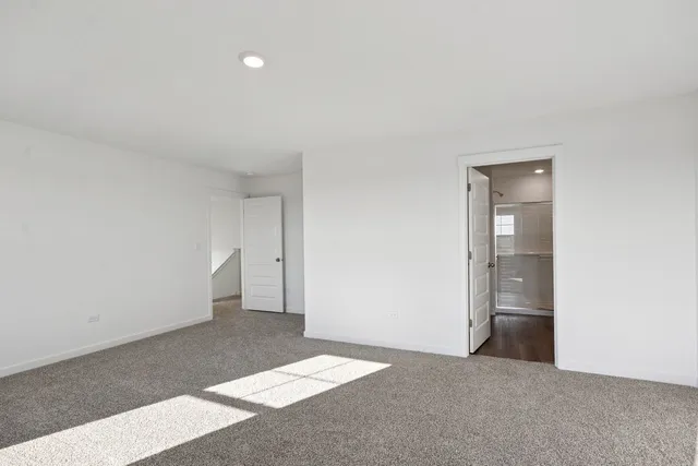 a view of an empty room and closet
