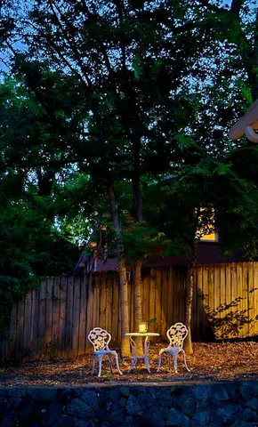 a outdoor living space with furniture and a fireplace