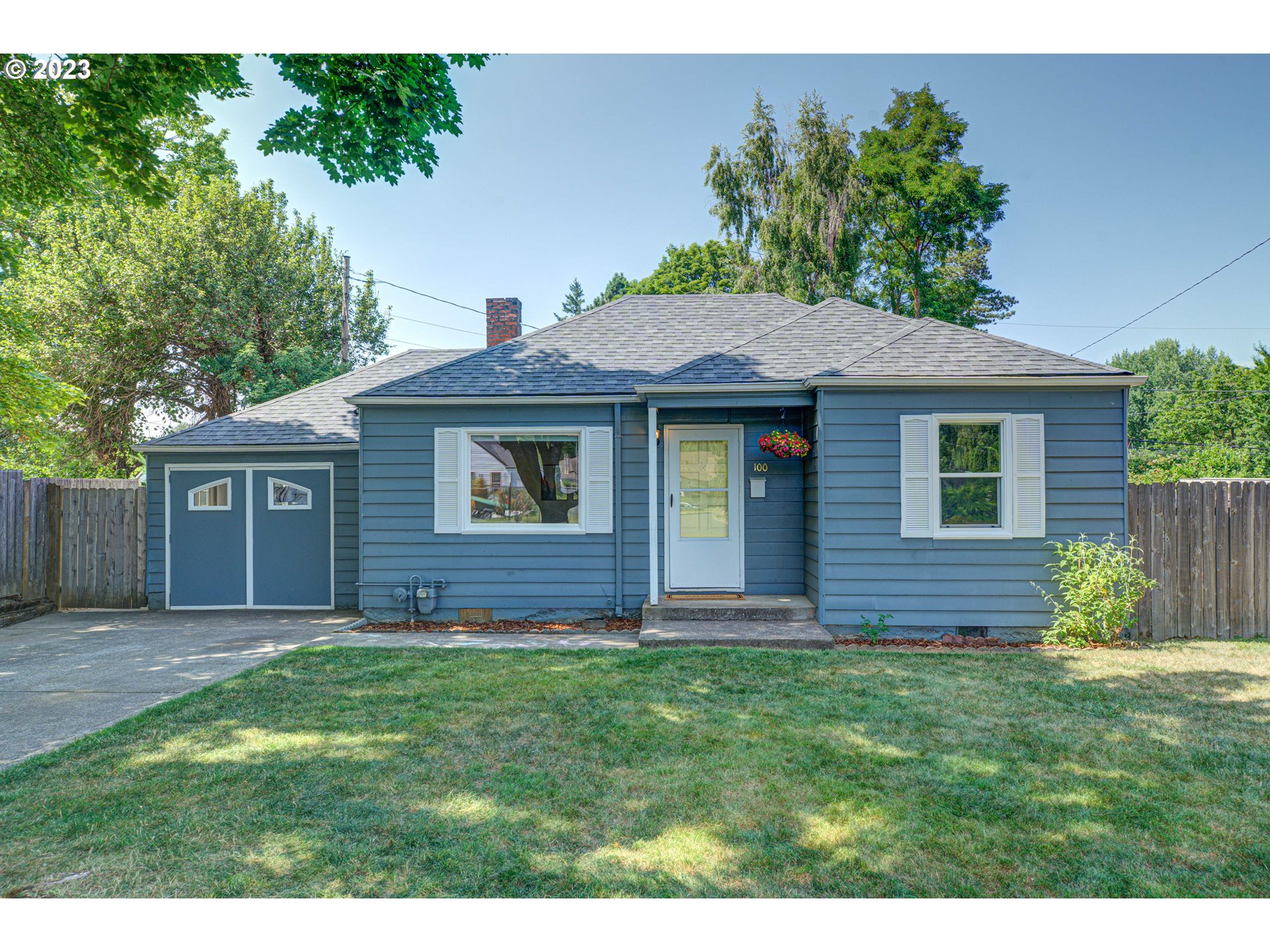 100 Maple Boulevard Wood Village, OR 97060 - Photo 1 of 37 a front view of a house with a garden
