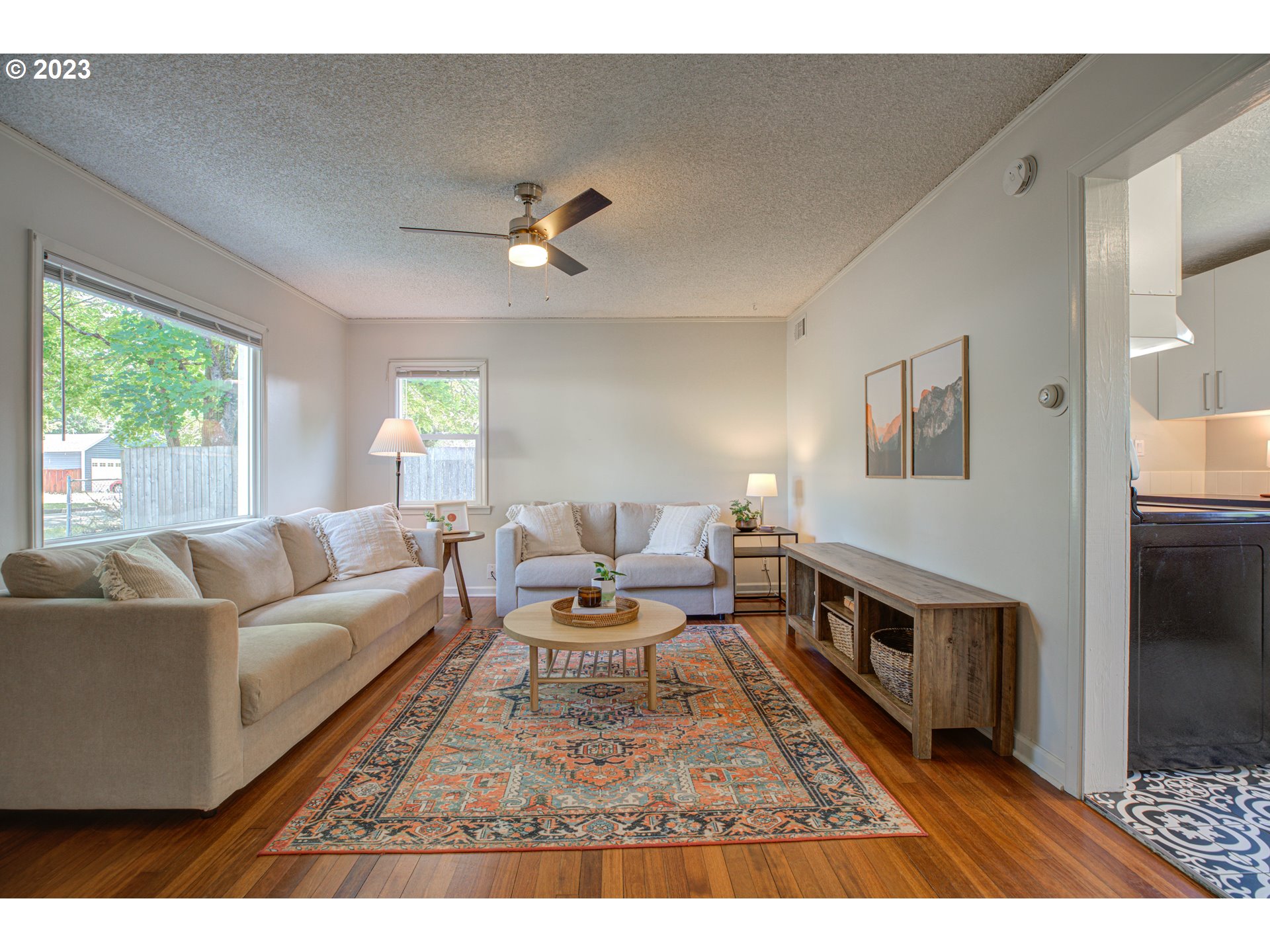 100 Maple Boulevard Wood Village, OR 97060 - Photo 11 of 37 a living room with furniture a fireplace and a window