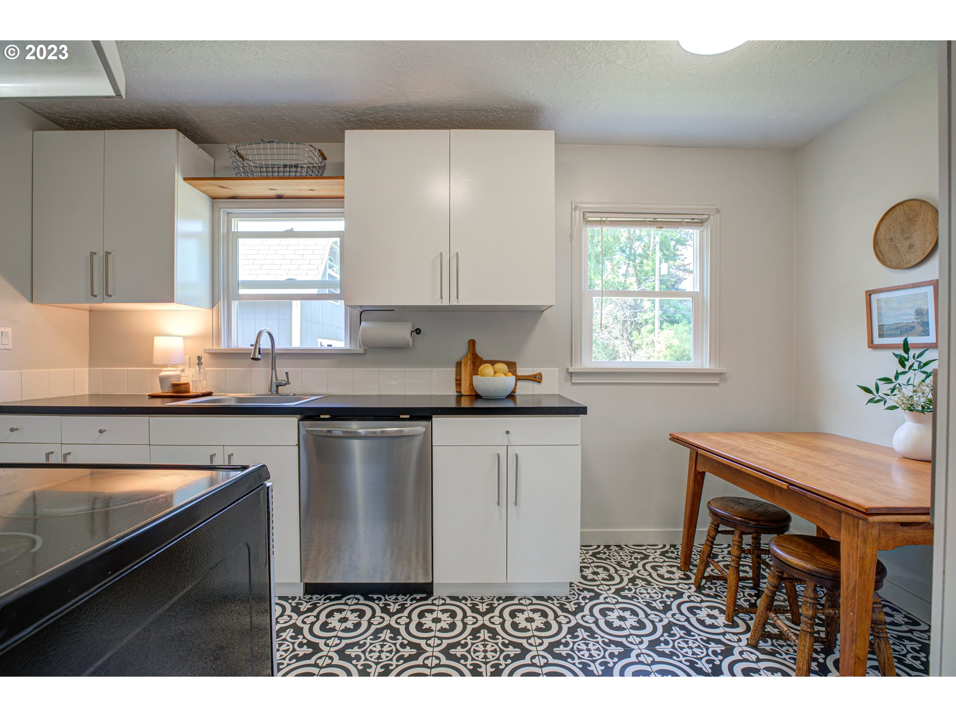 100 Maple Boulevard Wood Village, OR 97060 - Photo 12 of 37 a kitchen with a sink cabinets and window