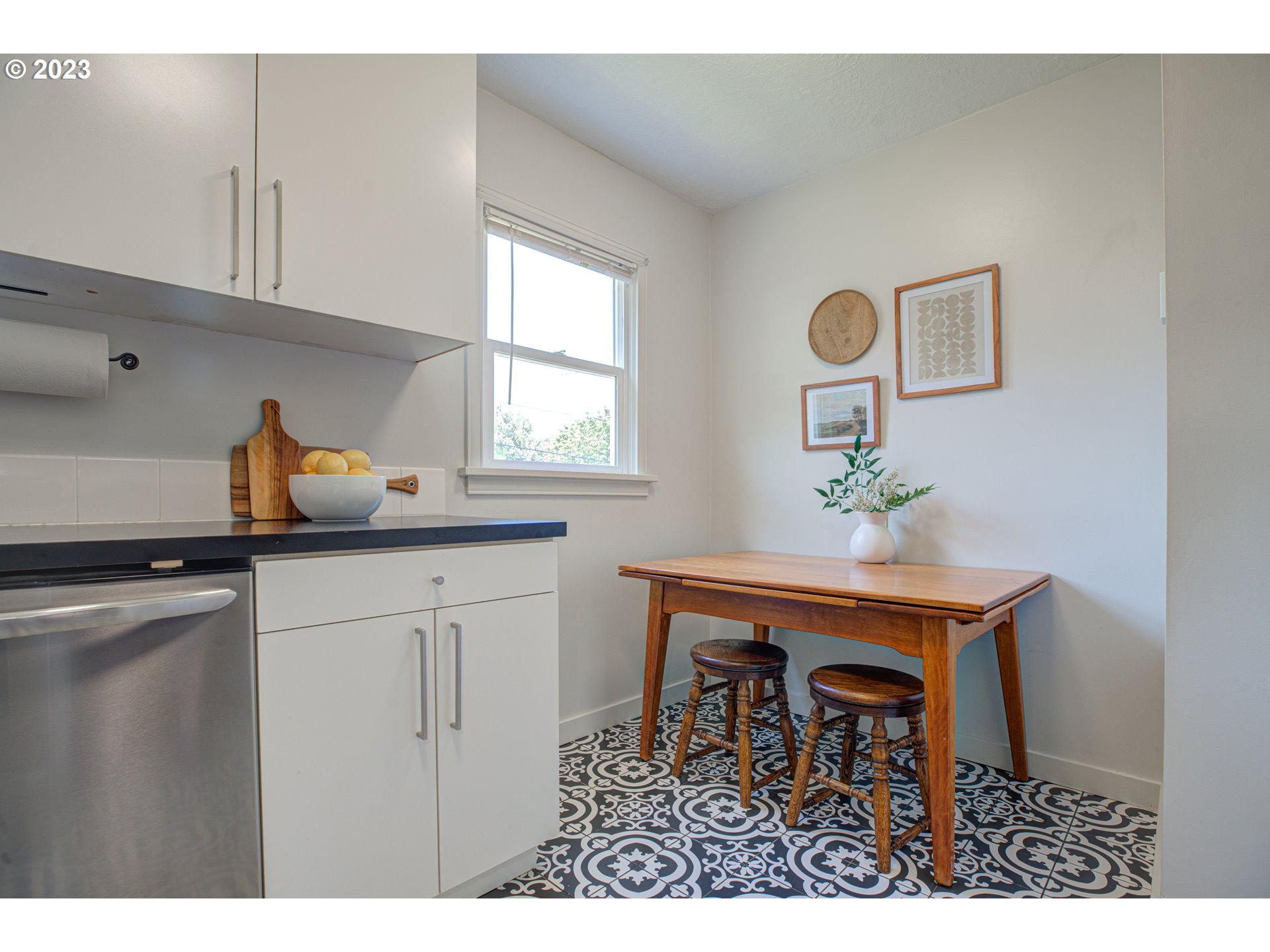 100 Maple Boulevard Wood Village, OR 97060 - Photo 13 of 37 a kitchen with a table and chairs in it