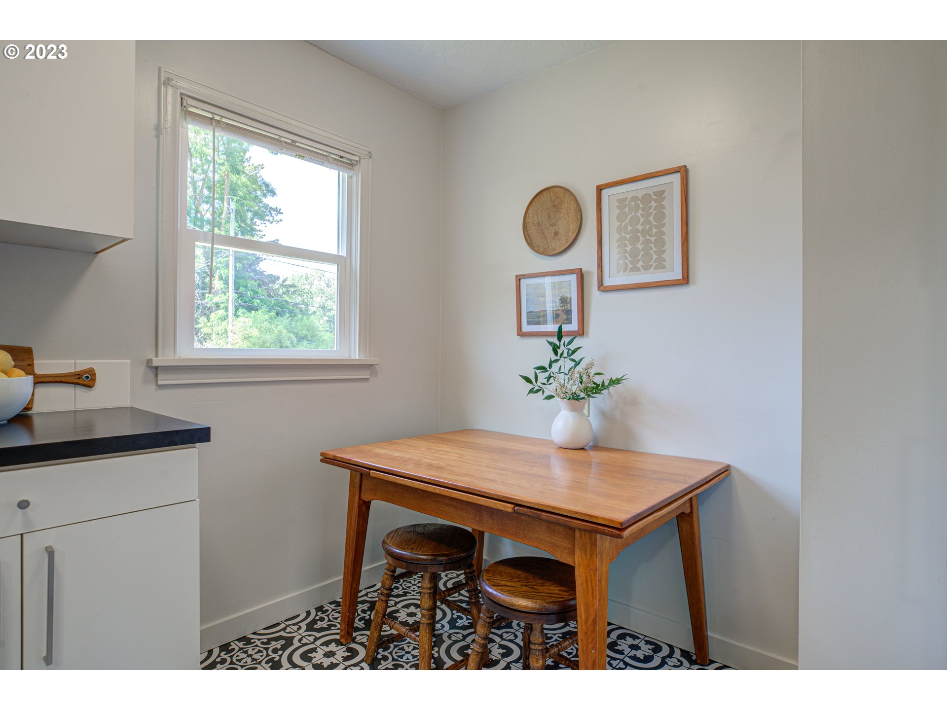 100 Maple Boulevard Wood Village, OR 97060 - Photo 14 of 37 a dining room with a table and chairs