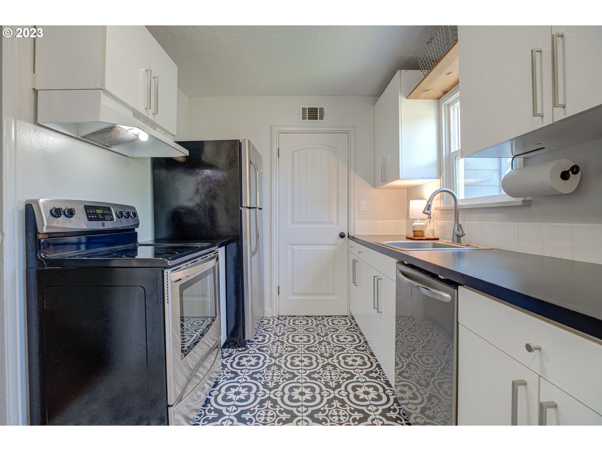 100 Maple Boulevard Wood Village, OR 97060 - Photo 16 of 37 a kitchen with stainless steel appliances a refrigerator and a sink