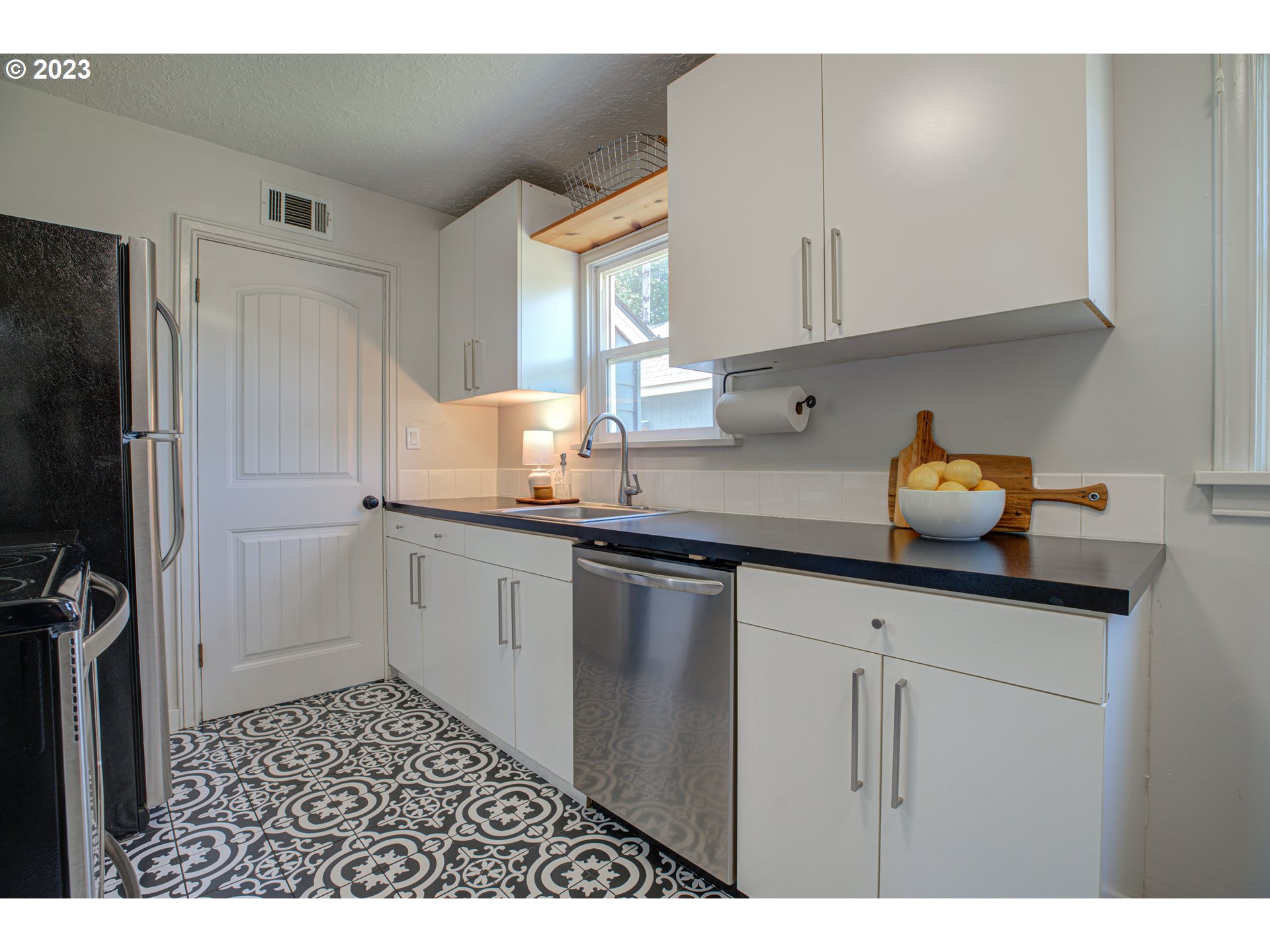 100 Maple Boulevard Wood Village, OR 97060 - Photo 17 of 37 a kitchen with a sink and cabinets
