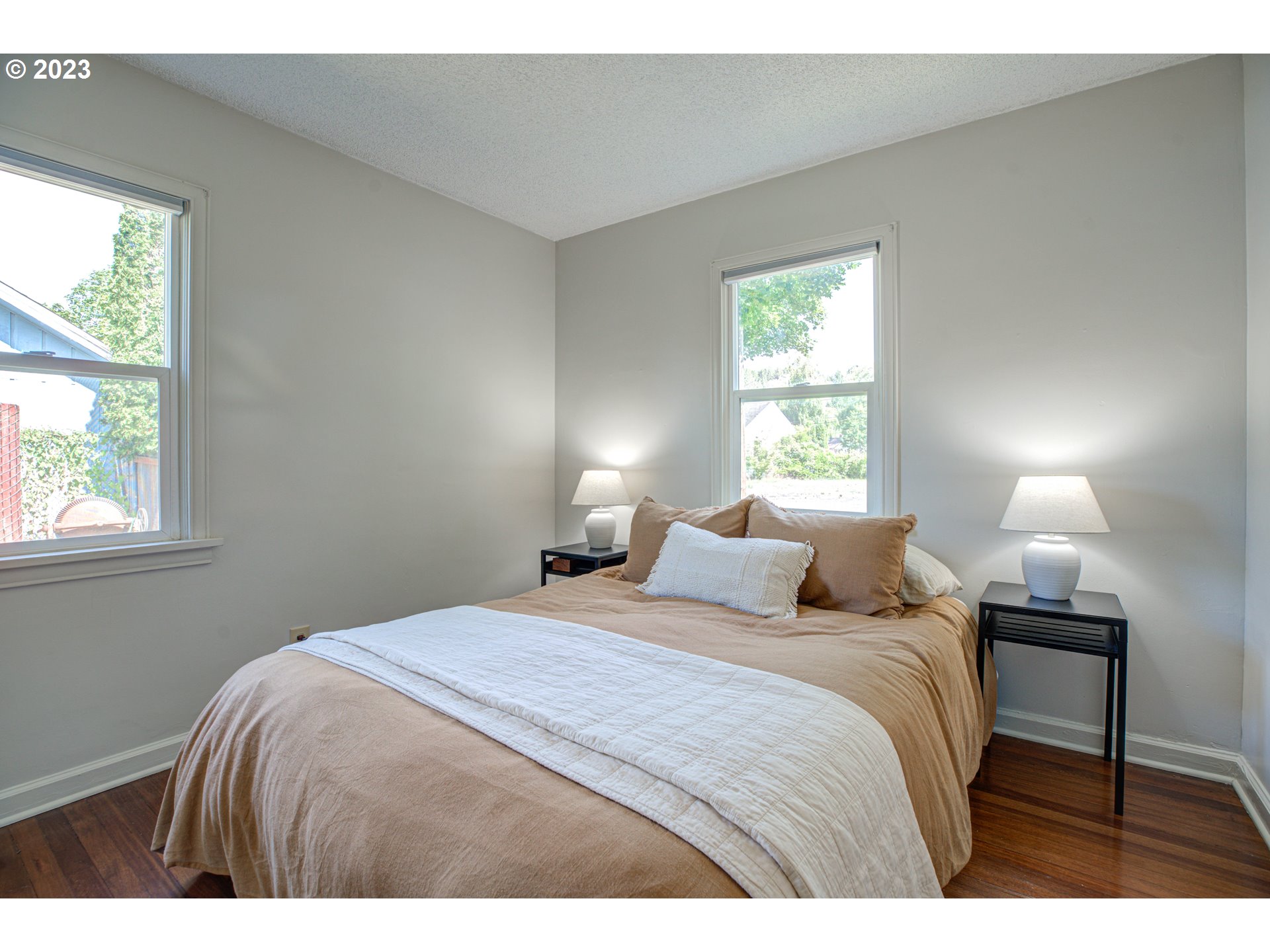 100 Maple Boulevard Wood Village, OR 97060 - Photo 20 of 37 a bedroom with a bed and a lamp