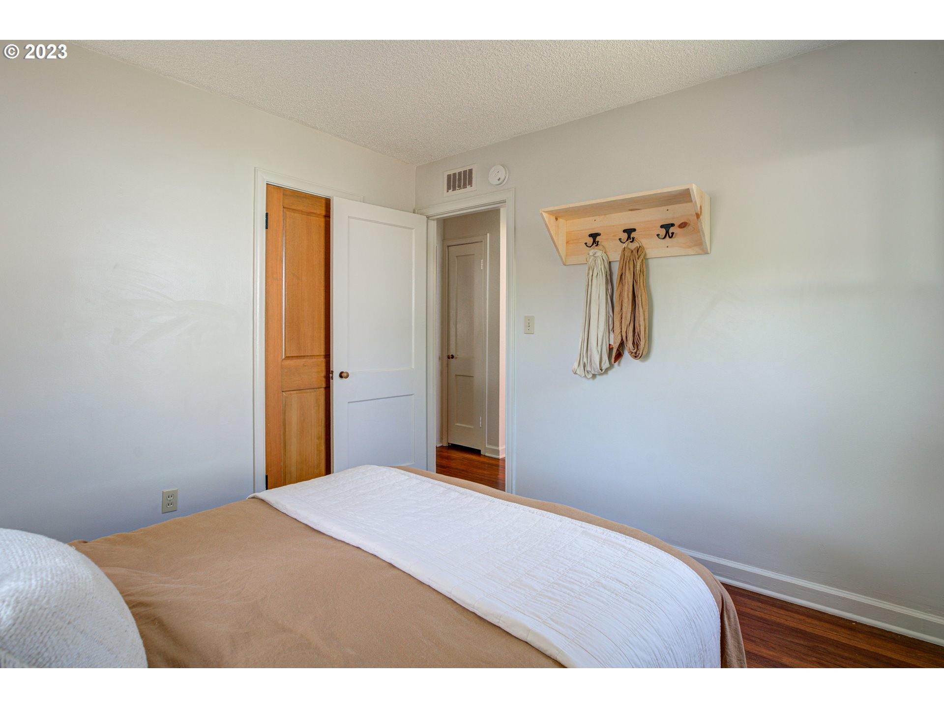 100 Maple Boulevard Wood Village, OR 97060 - Photo 22 of 37 a bedroom with a bed and mirror