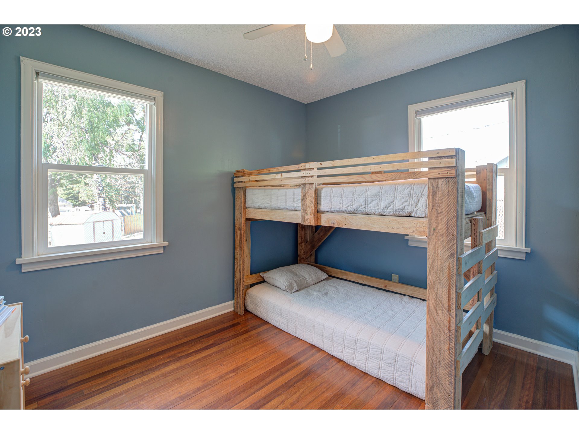 100 Maple Boulevard Wood Village, OR 97060 - Photo 23 of 37 a bedroom with a bed and a window
