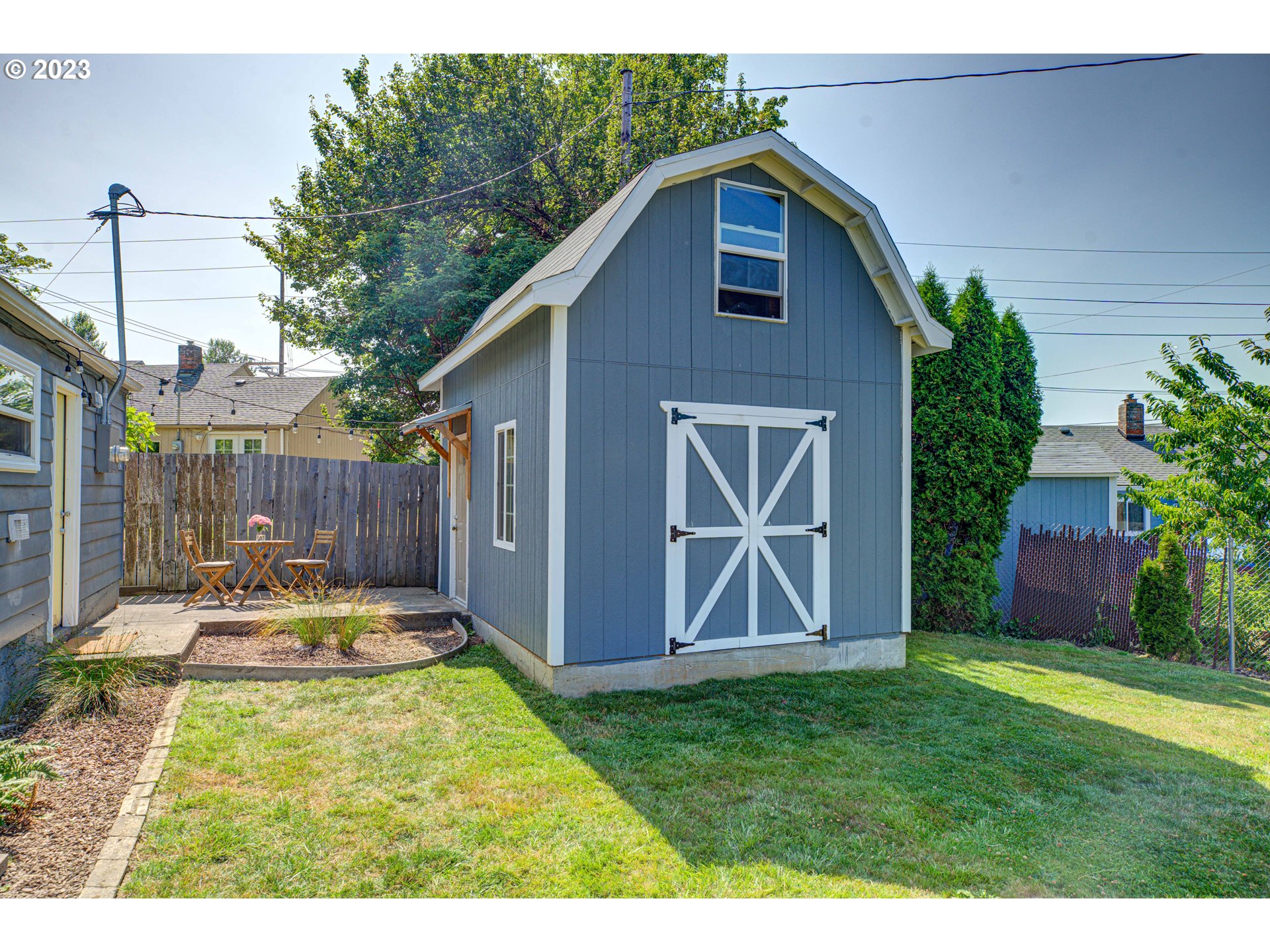 100 Maple Boulevard Wood Village, OR 97060 - Photo 29 of 37 a view of an house with backyard space and garden