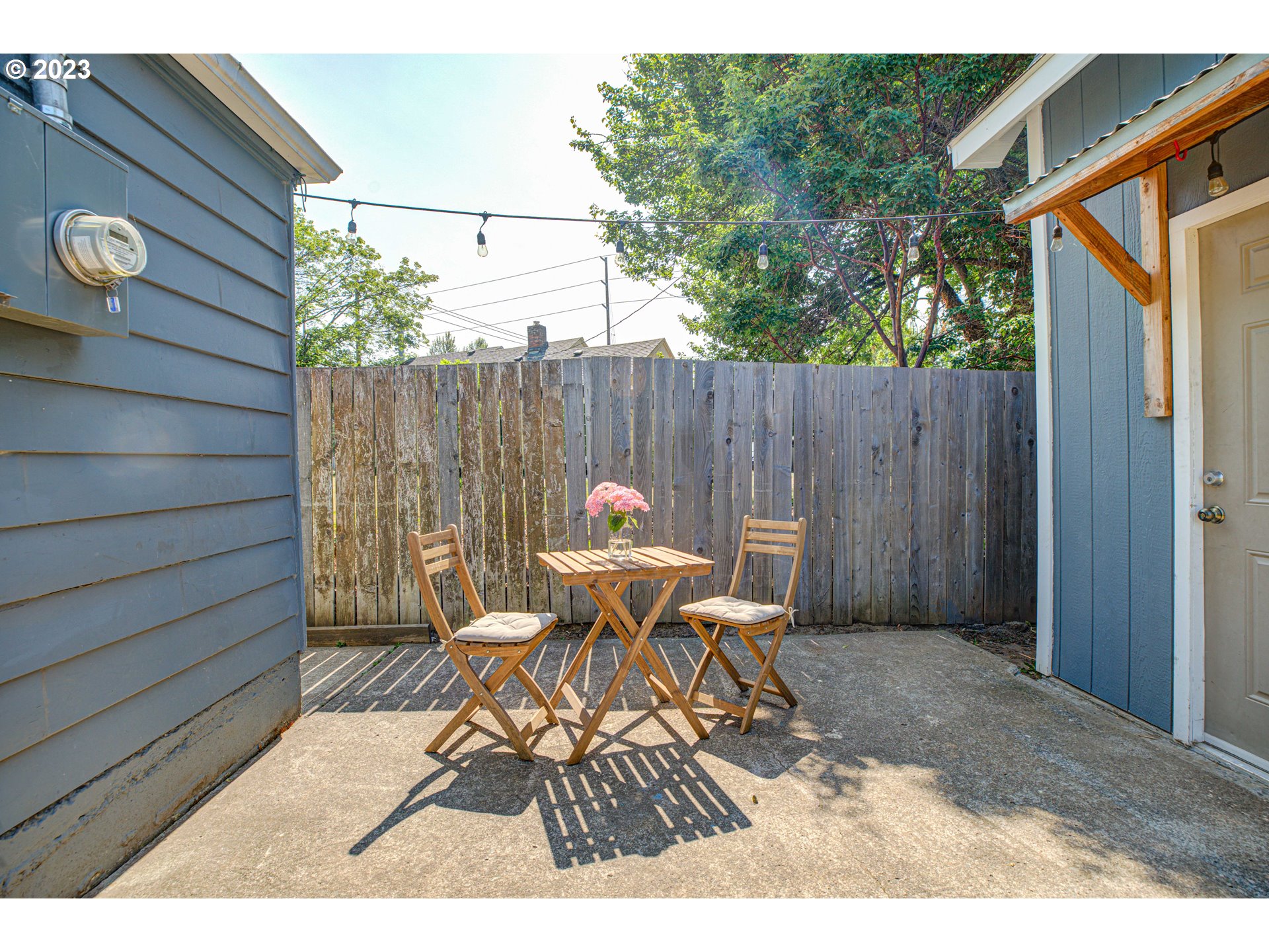100 Maple Boulevard Wood Village, OR 97060 - Photo 30 of 37 a patio with table and chairs