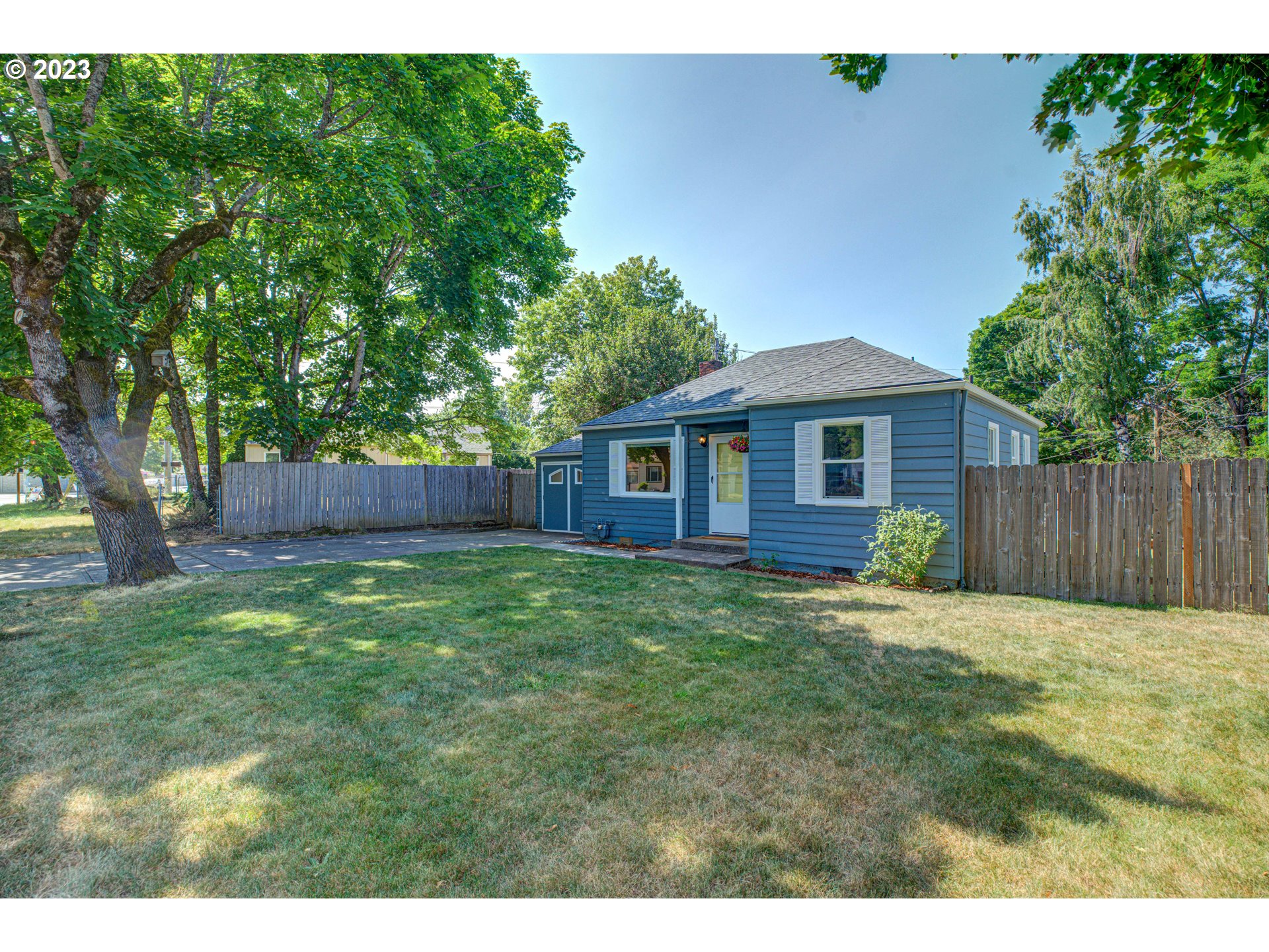 100 Maple Boulevard Wood Village, OR 97060 - Photo 4 of 37 a backyard of a house with lots of green space