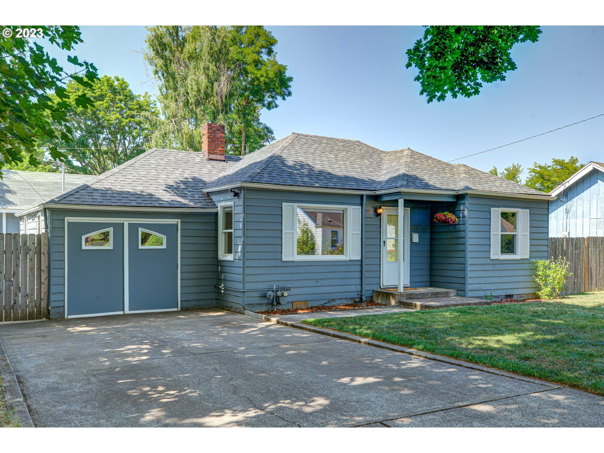 100 Maple Boulevard Wood Village, OR 97060 - Photo 6 of 37 a front view of a house with a garden and yard