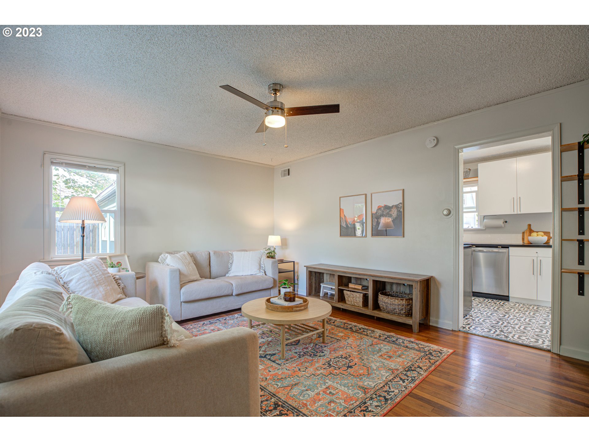 100 Maple Boulevard Wood Village, OR 97060 - Photo 8 of 37 a living room with furniture and a wooden floor