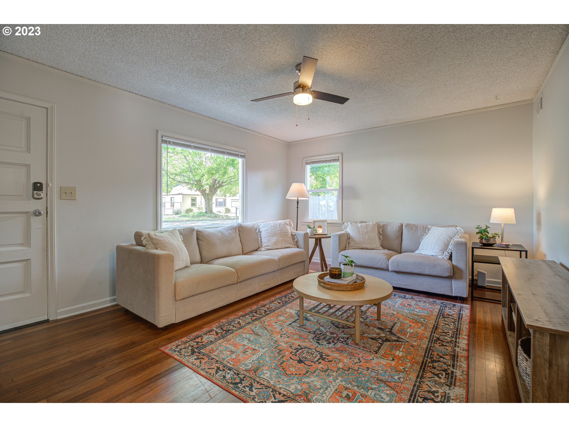 100 Maple Boulevard Wood Village, OR 97060 - Photo 9 of 37 a living room with furniture and a wooden floor