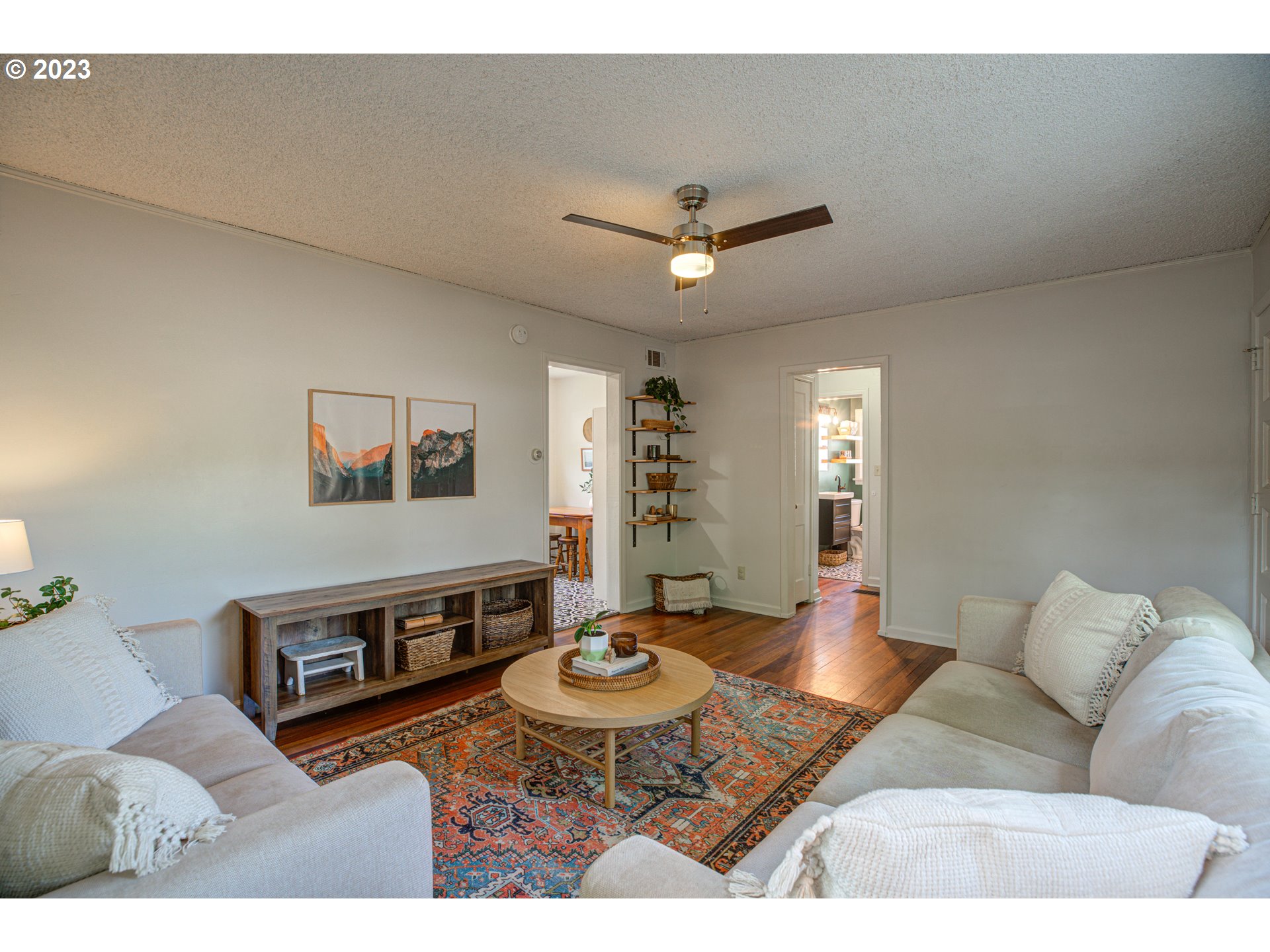 100 Maple Boulevard Wood Village, OR 97060 - Photo 10 of 37 a living room with furniture and a wooden floor