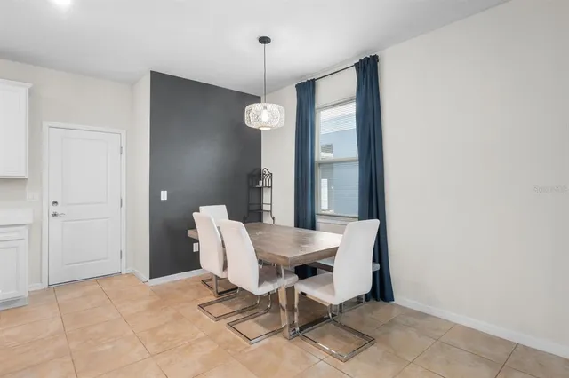 a bedroom with a bed and a ceiling fan