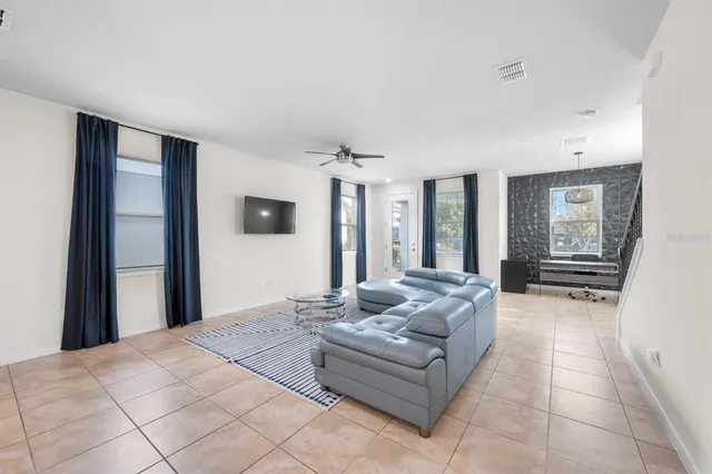 a kitchen with kitchen island cabinets and refrigerator